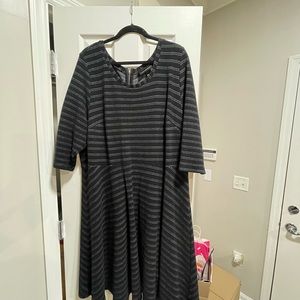 Black knit dress with grey piping.